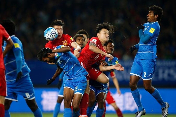 China and Maldives players in action during their recent World Cup qualifying match.