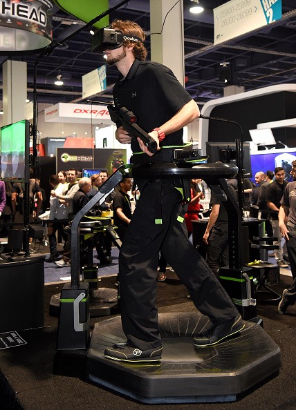 Jeremy Gaddis uses the Virtuix Omni, an omni-directional treadmill virtual reality gaming system with Oculus Rift.