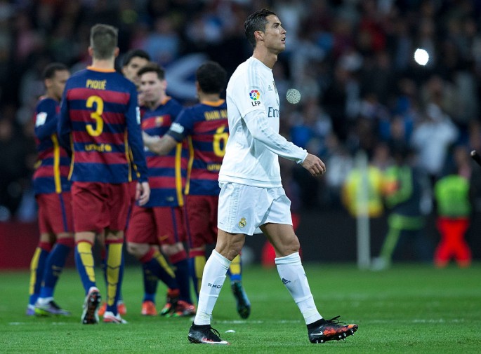 Real Madrid's Cristiano Ronaldo walks away from Lionel Messi and his Barcelona teammates during the most recent El Clásico.