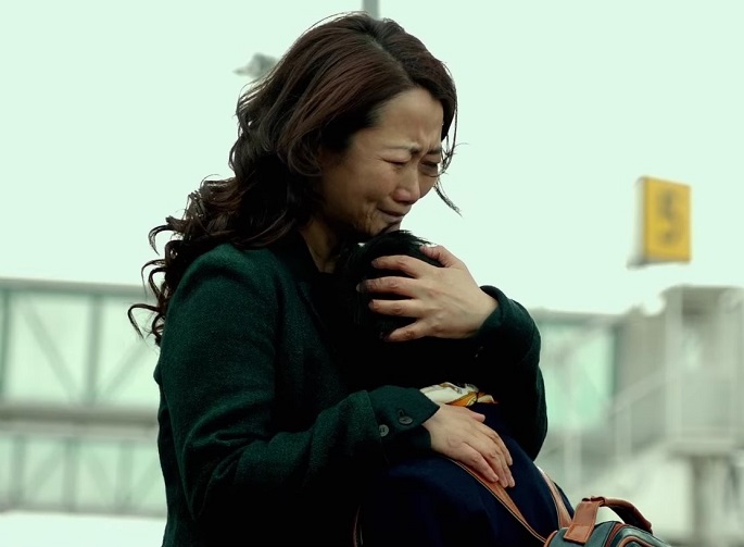 Mountains may depart but never a mother’s love: Zhao Tao, who lost a custody battle, embraces her son who will live with his father in Australia in Jia Zhangke’s 2015 drama, “Mountains May Depart.”