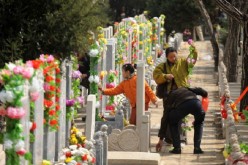 Where have all the flowers gone: Garlands adorn the tombstones of this cemetery. Some foreigners chose to be laid to rest in China.