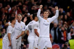 Real Madrid forward Cristiano Ronaldo (extreme right) celebrates his goal against Roma in their recent Champions League match.