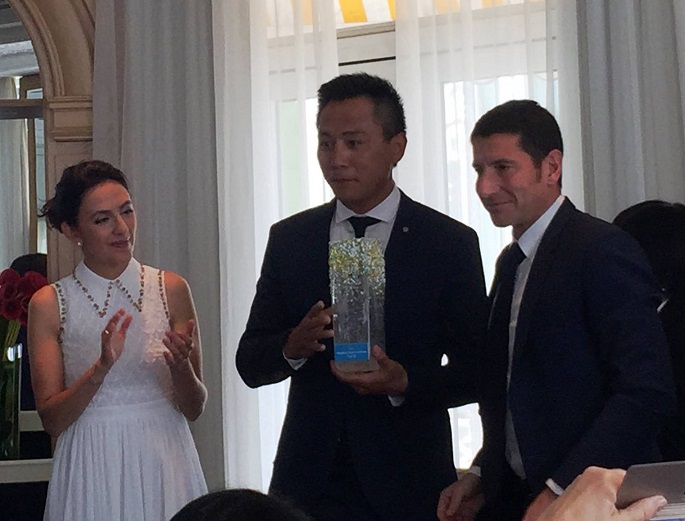 Merci! Liu Ye is flanked by his French wife Anais Martane and David Lisnard, mayor of Cannes, during his appointment as travel ambassador for the French Riviera.