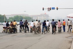Two wheels will do: Traditional bikes, motorcycles and electronic bikes or e-bikes continue to be a favorite mode of transportation in China. 