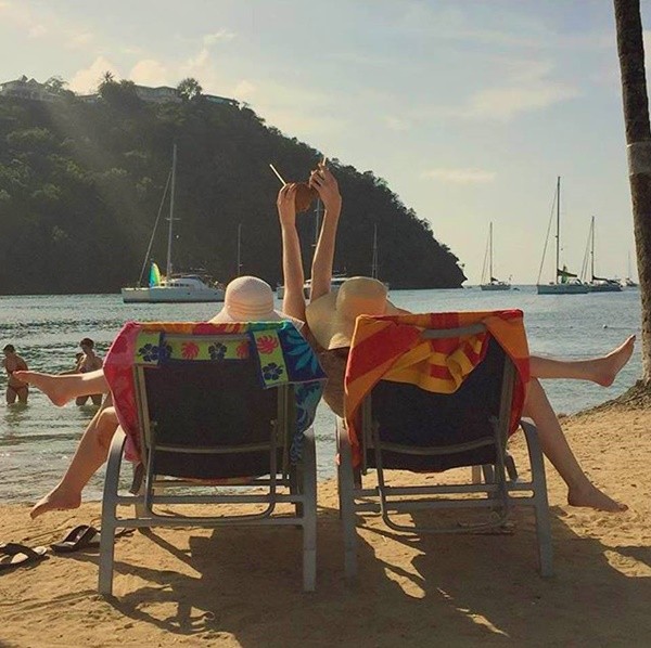 These women enjoy their summer break by choosing to relax by the beach in St. Lucia