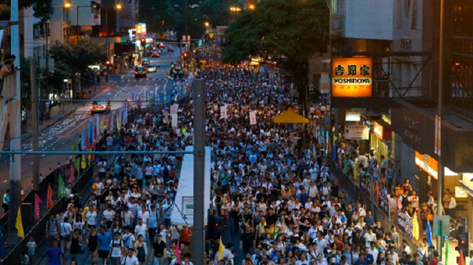Protesters marched the streets to support the Hong Kong Rally for Democracy on July 1, 2014.