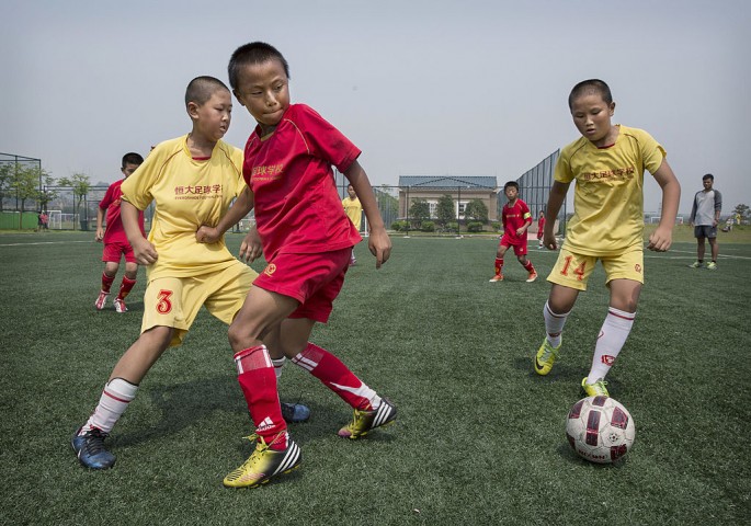 China is investing in young soccer players for a bigger goal.