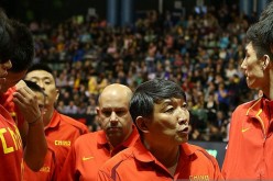 China men's national basketball team head coach Gong Luming (middle).