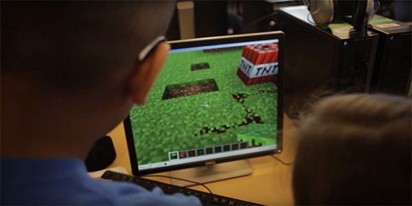 Two children try out "Minecraft: Education Edition" and share the fun together.