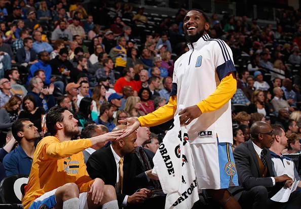 Danilo Gallinari and Kenneth Faried of the Denver Nuggets celebrate on the bench 