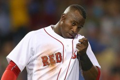  Rusney Castillo of the Boston Red Sox reacts after he was caught off third base.