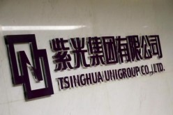 The logo of Tsinghua Unigroup is seen at its office in Beijing, China.