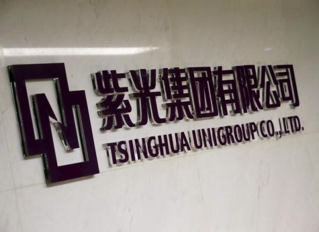 The logo of Tsinghua Unigroup is seen at its office in Beijing, China.