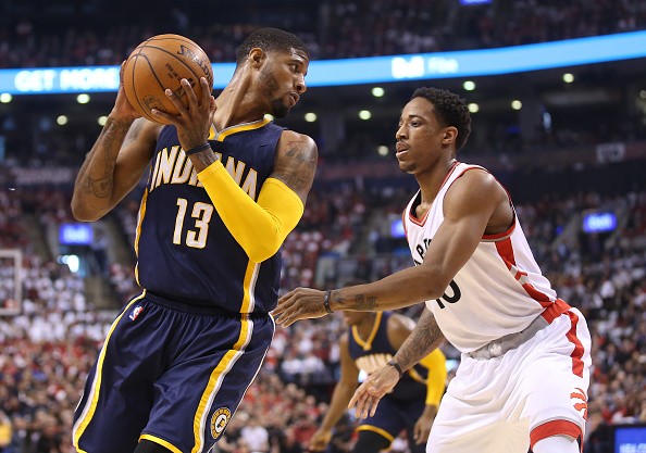 DeMar DeRozan defends Paul George during game 1 of the Toronto Raptors vs. Indiana Pacers first round playoff match-up.