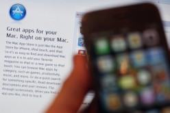 In this photo illustration, a computer in a coffee shop displays onscreen the new Apple App store launched on Jan. 6, 2011 in London, England. 