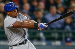 Adrian Beltre of the Texas Rangers hits an RBI single in the third inning against the Seattle Mariners. 