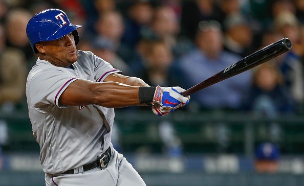Adrian Beltre of the Texas Rangers hits an RBI single in the third inning against the Seattle Mariners. 