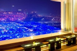 A lounge at Pangu 7 Star Hotel Beijing in Chaoyang, a part of the high-end complex Pangu Plaza whose developer is Guo Wengui, provides an outstanding view of the Bird’s Nest.