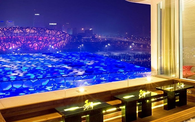 A lounge at Pangu 7 Star Hotel Beijing in Chaoyang, a part of the high-end complex Pangu Plaza whose developer is Guo Wengui, provides an outstanding view of the Bird’s Nest.