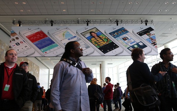 Attendees gather at the Apple Worldwide Developers Conference at the Moscone West center on June 2, 2014 in San Francisco, California. 