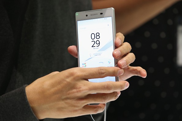 A visitor looks at an Xperia Z5 smartphone at the Sony stand at the 2015 IFA consumer electronics and appliances trade fair on Sept. 4, 2015 in Berlin, Germany. 