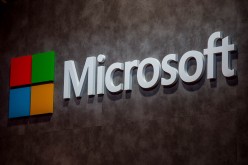 A logo sits illuminated outside the Microsoft pavilion on the opening day of the World Mobile Congress at the Fira Gran Via Complex on Feb. 22, 2016 in Barcelona, Spain. 