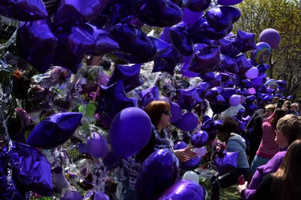 A crowd of fans gathered outside the Paisley Park compound, some brought balloons and wore the musician's favorite color: purple.