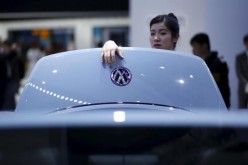 A prospective buyer inspects a Volkswagen in an automobile show in Shanghai last year.