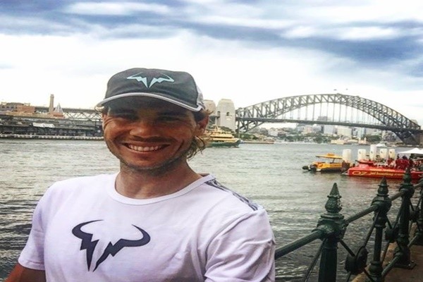 Rafael Nadal enjoys a break by the Harbour Bridge in Sydney, Australia.
