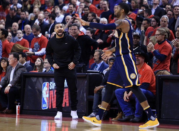 Drake is taunting Paul George during game 5 of the Toronto Raptors vs. Indiana Pacers 1st round match-up.