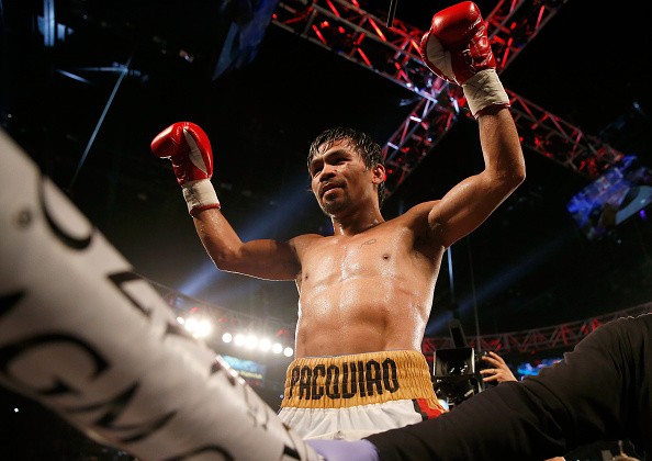 Manny Pacquiao celebrates after defeating Timothy Bradley Jr. by unanimous decision.