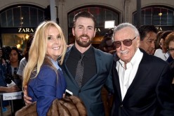 Stan Lee poses for a photo with actor Chris Evans at the premiere of 