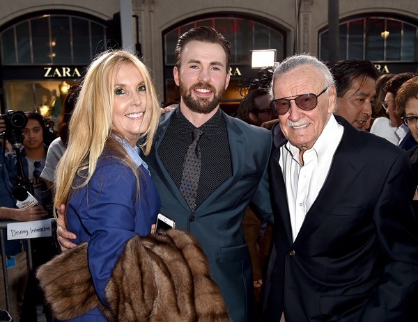 Stan Lee poses for a photo with actor Chris Evans at the premiere of "Captain America: Civil War" in Los Angeles, California on April 12.
