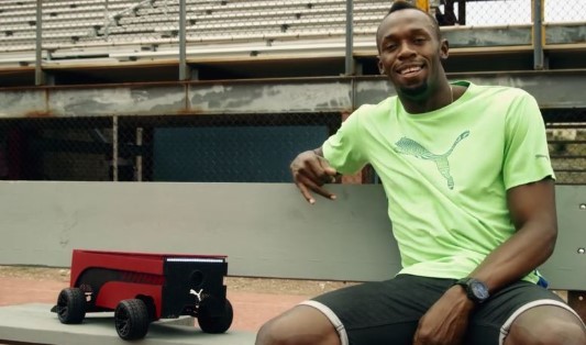 Usain Bolt is seen with the Puma BeatBot