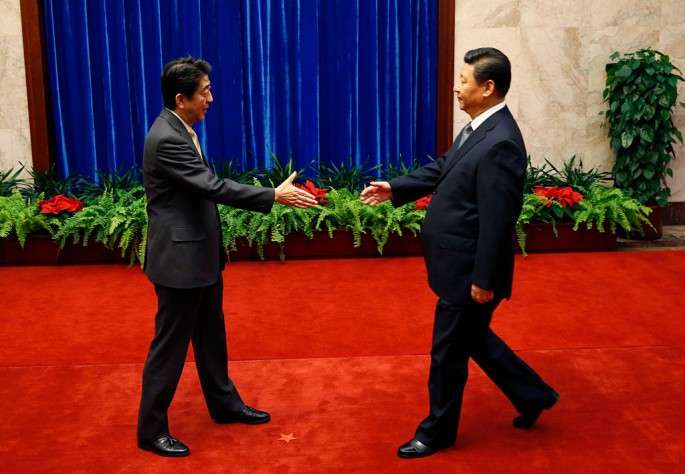 Japanese President Shinzo Abe meeting with President Xi Jinping. Sino-Japanese ties improve as China welcomes the first Japanese dignitary in four years.