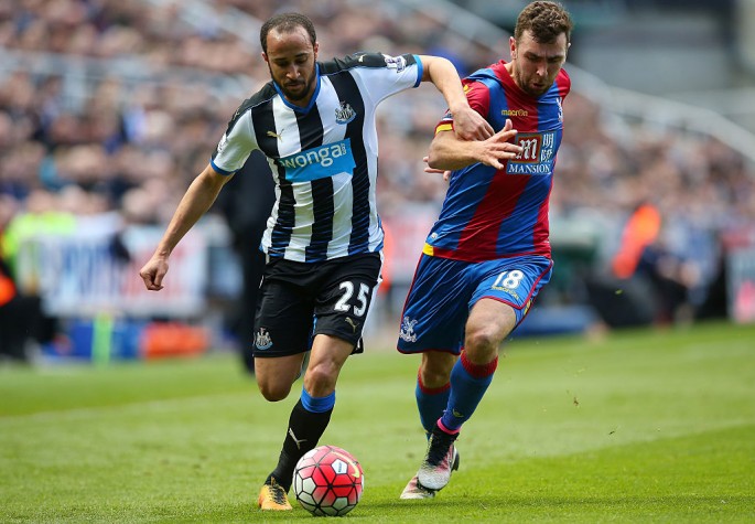 Newcastle United winger Andros Townsend (L) competes for the ball against Crystal Palace's James McArthur.