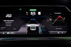 The dashboard of Tesla 'D' model electric sedan is seen on a giant screen in 2014.  